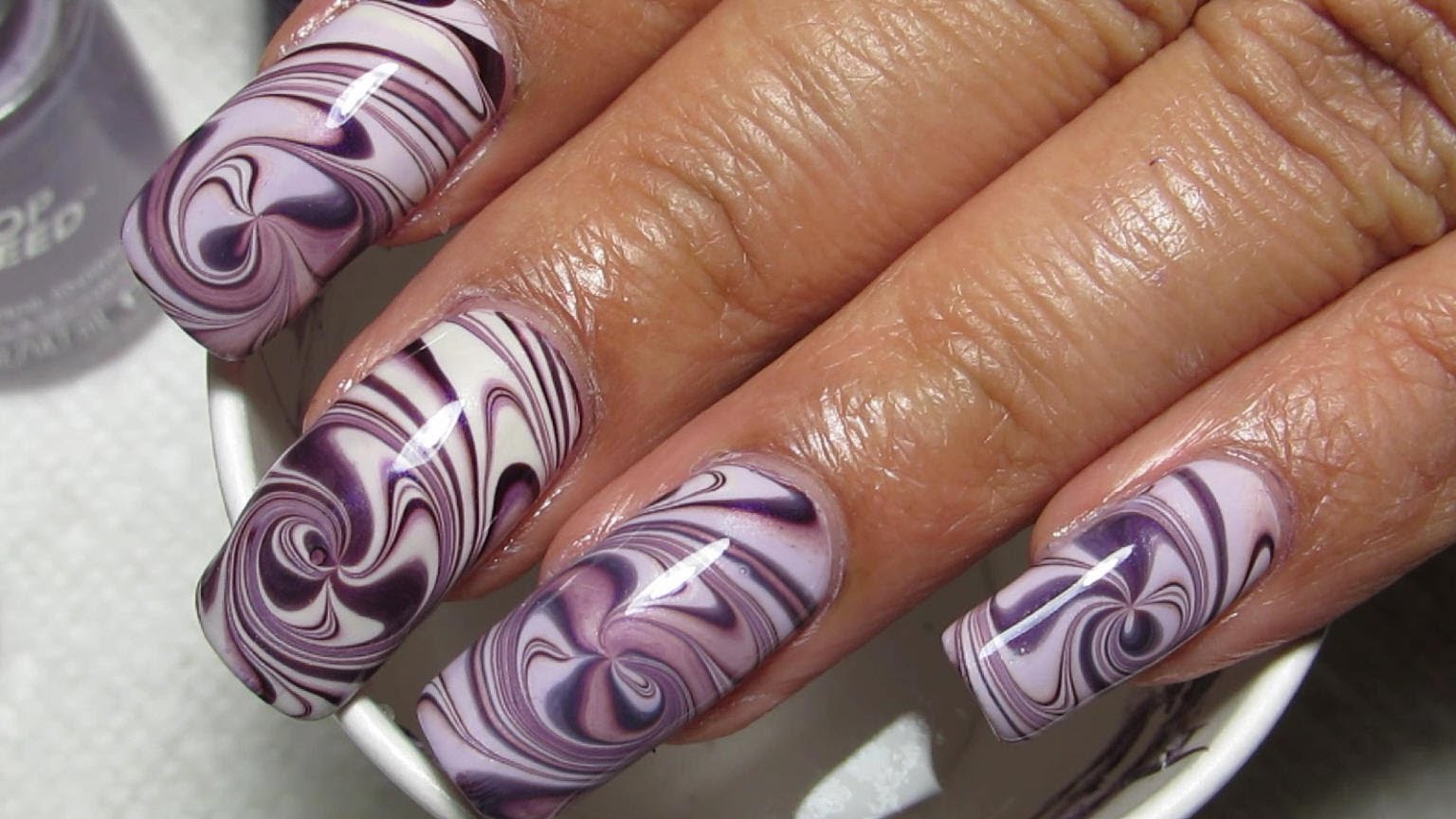 Hypnotize Anyone Who Looks At Your Nails With This Gorgeous Purple Spiral Water Marble Nail Art! Hypnotize Anyone Who Looks At Your Nails With This Gorgeous Purple Spiral Water Marble Nail Art!